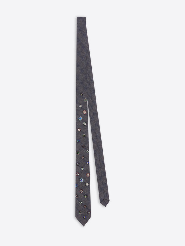 Navy blue floral patterned tie on a white background