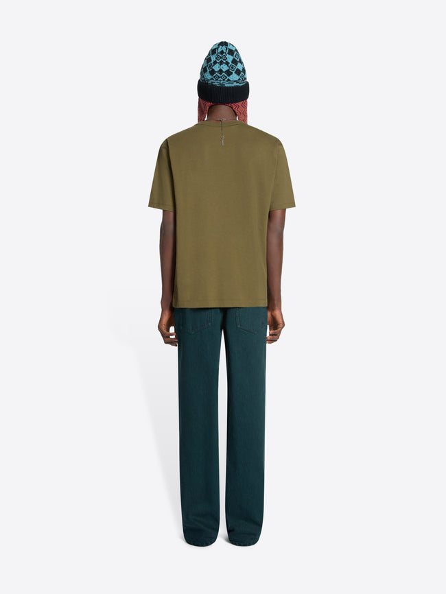 Back view of a person wearing a green t-shirt and dark green pants on a white background