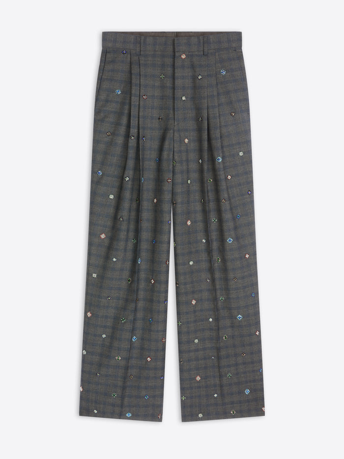 Dark gray plaid pants with small colorful patterns on a white background
