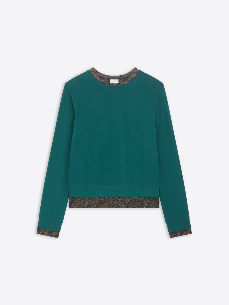 Teal sweater with patterned hem on a white background