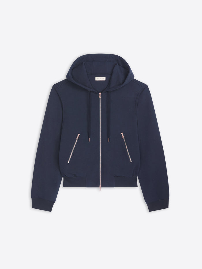 Navy blue hoodie with zippers on a light gray background