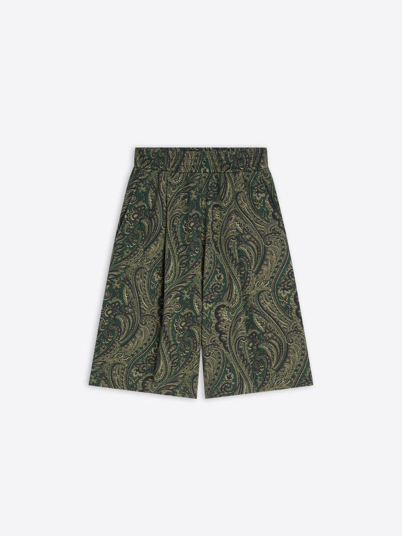 Green paisley patterned shorts on a white background