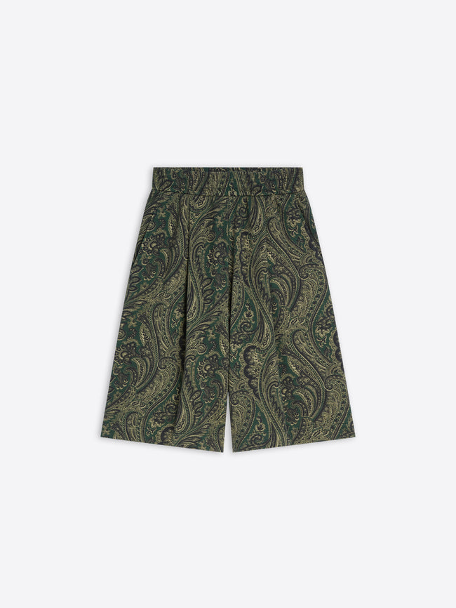 Green paisley patterned shorts on a white background
