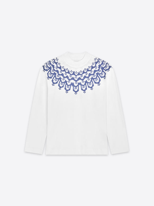 White long sleeve with blue lace detailing on a white background