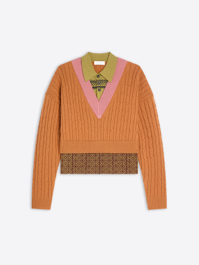 Orange sweater with patterned band and collar on a white background