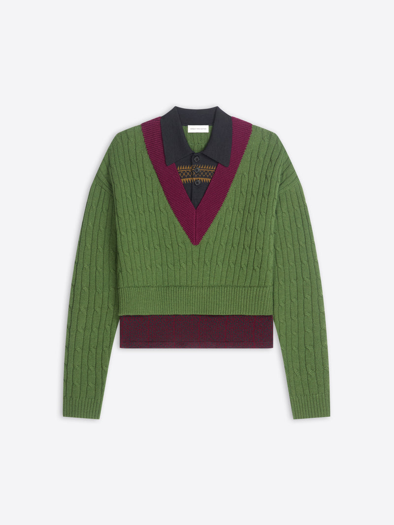 Green sweater with patterned band and collar on a white background
