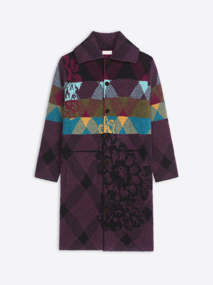 Colorful patchwork coat with geometric patterns on a white background