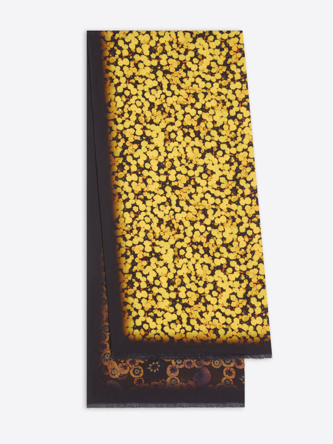 Scarf with a black and yellow pattern on a white background