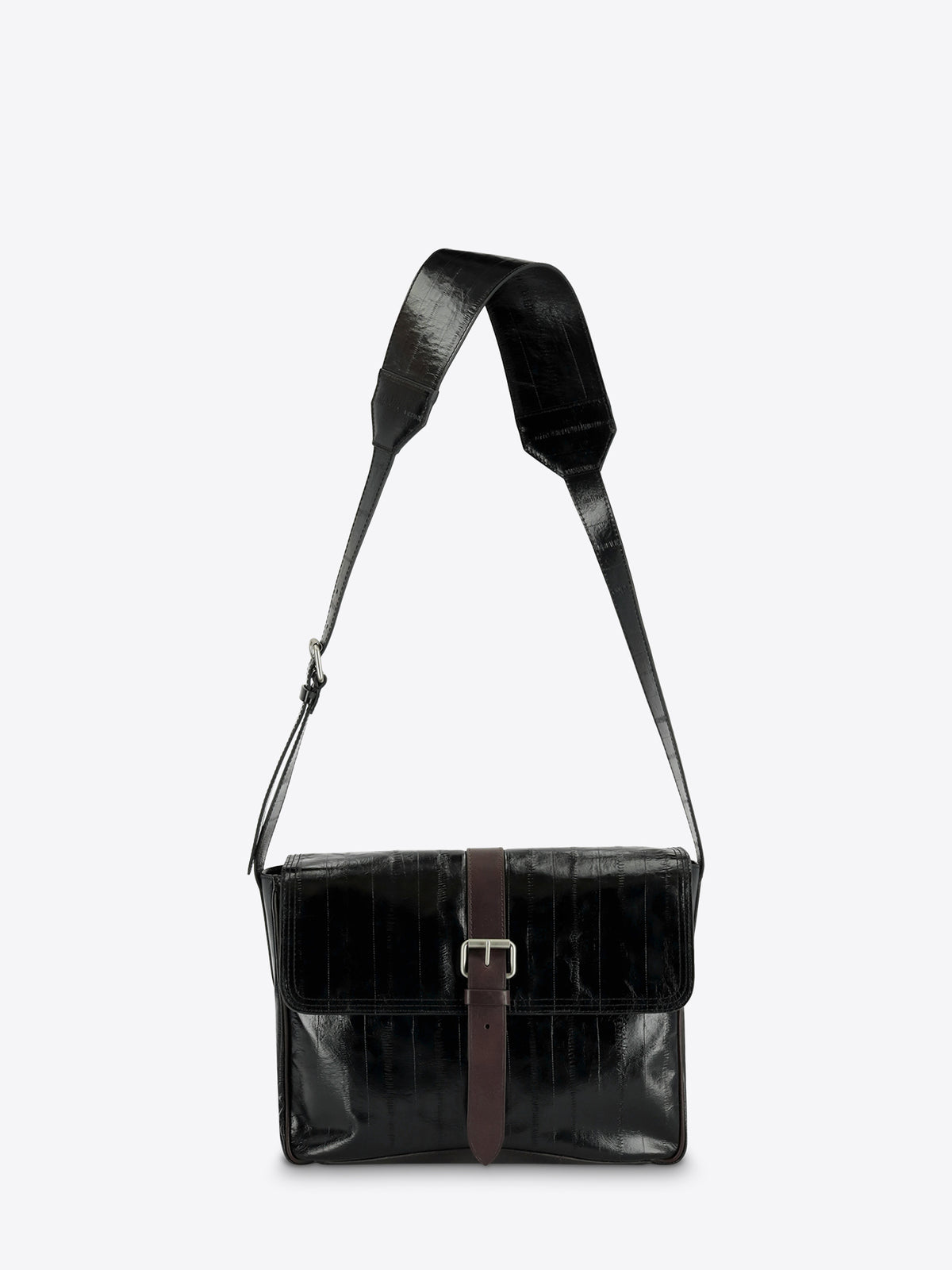 A black leather messenger bag with a brown leather strap detail and silver buckle, featuring a wide adjustable shoulder strap, shown against a light gray background.
