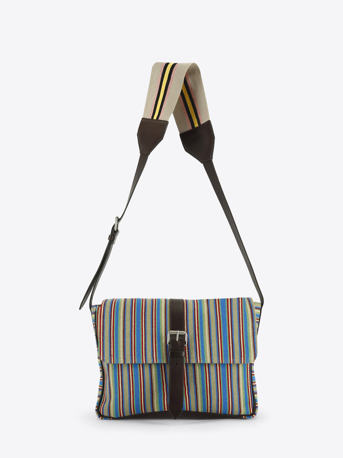 Multicolored striped shoulder bag with dark brown leather trim, a front buckle closure and an adjustable striped strap, shown against a light grey background.
