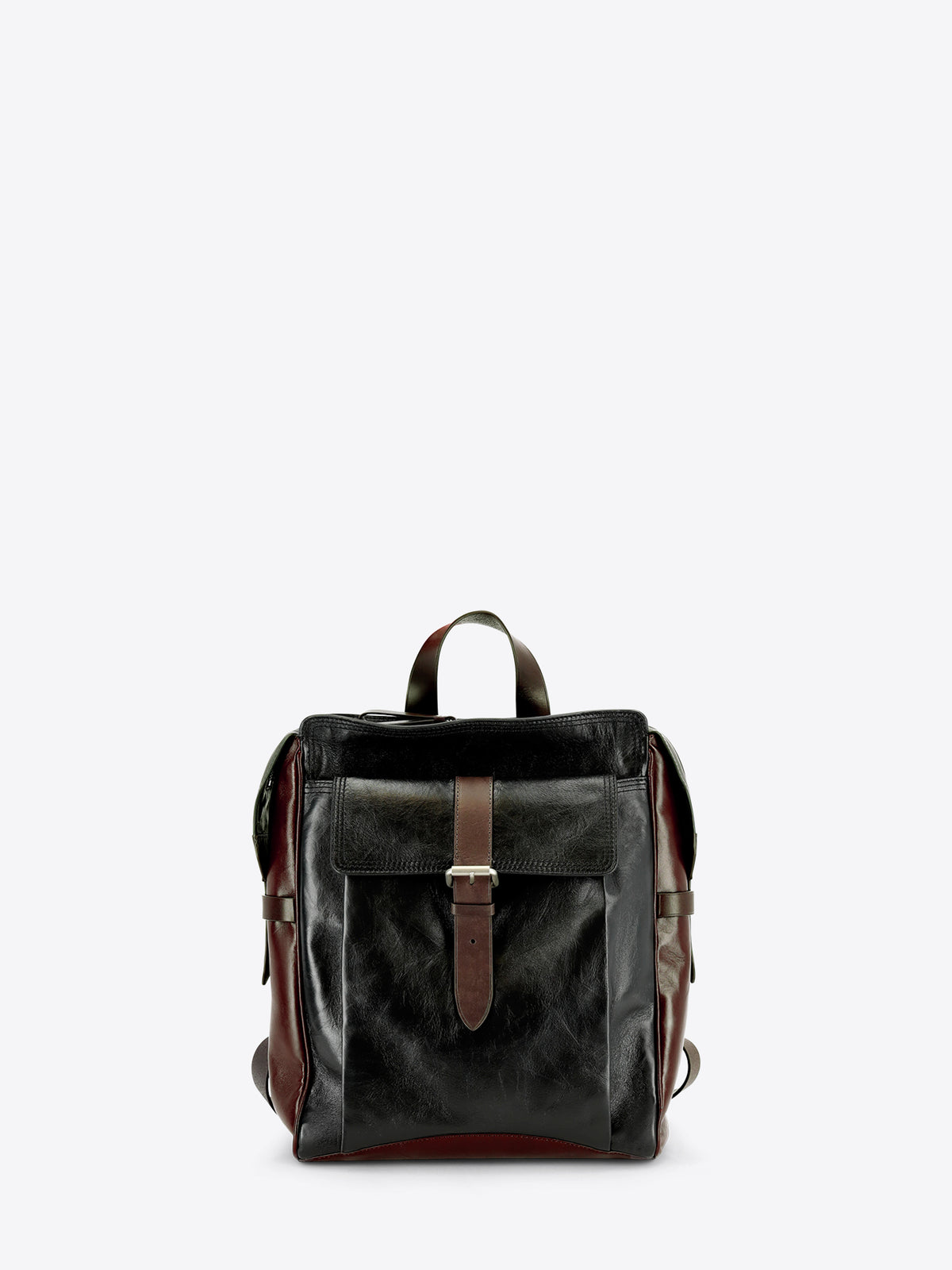 A dark brown and black leather backpack with a front flap pocket and brown leather strap details, shown against a light gray background.