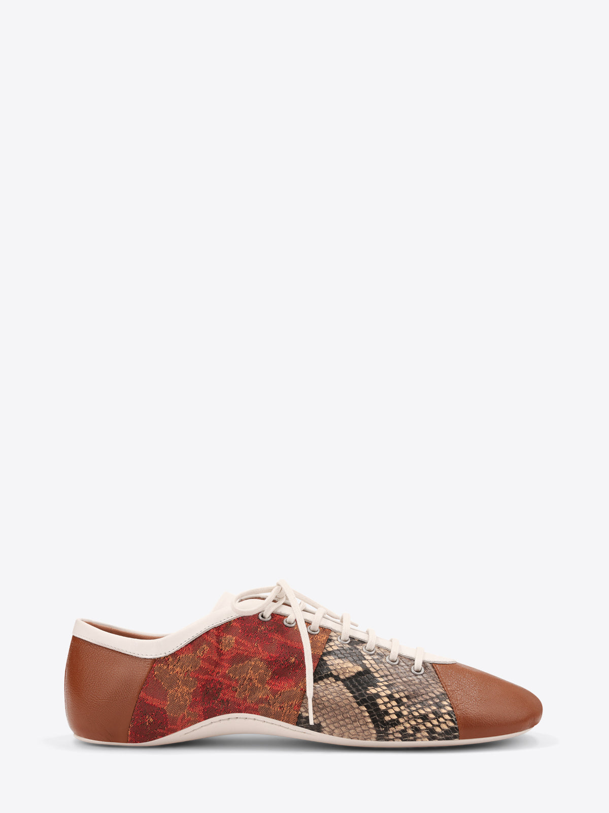 A low-top lace-up shoe featuring a brown leather toe and heel, a red and gold patterned side panel, and a snakeskin-patterned panel on the front, set against a light gray background.