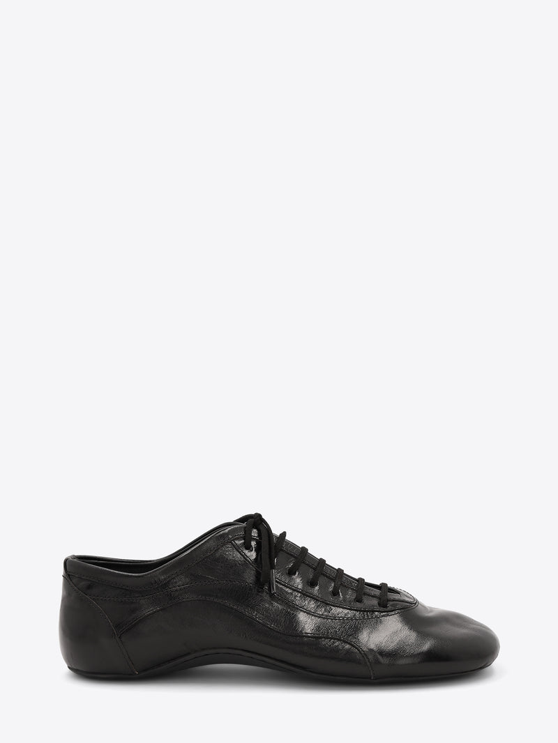 A single black leather low-top lace-up shoe with a glossy finish, displayed on a light gray background.