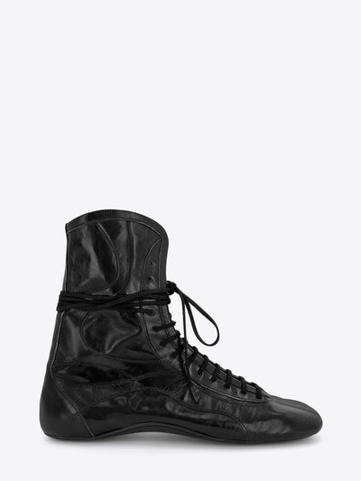 A single black leather lace-up boot with a glossy finish, shown on a light gray background.