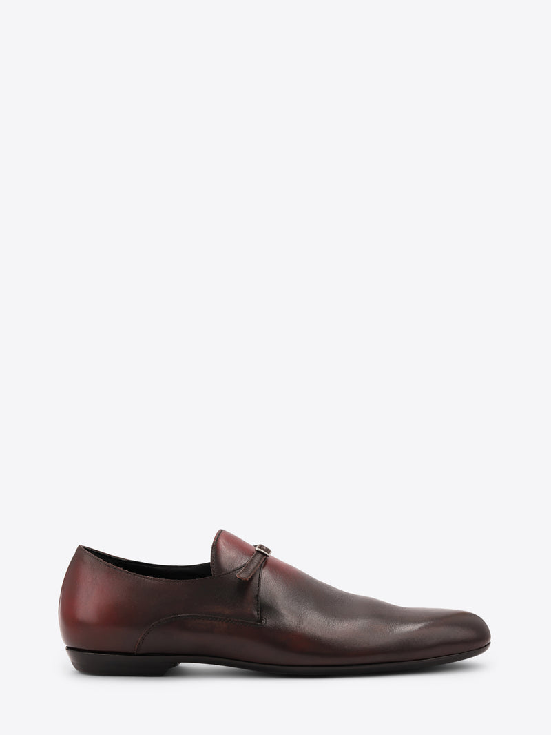 A dark brown leather shoe with a subtle gradient finish, shown on a white background.
