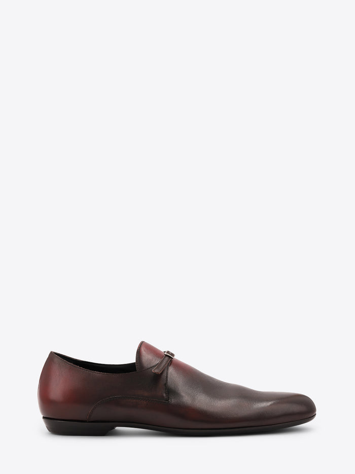 A dark brown leather shoe with a subtle gradient finish, shown on a white background.