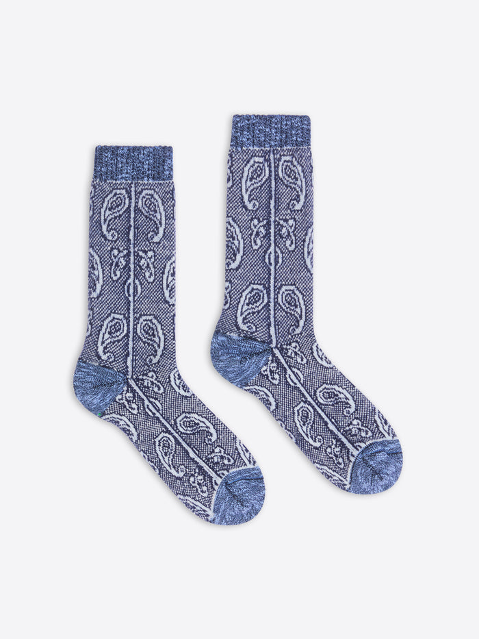 Pair of blue patterned socks on a white background