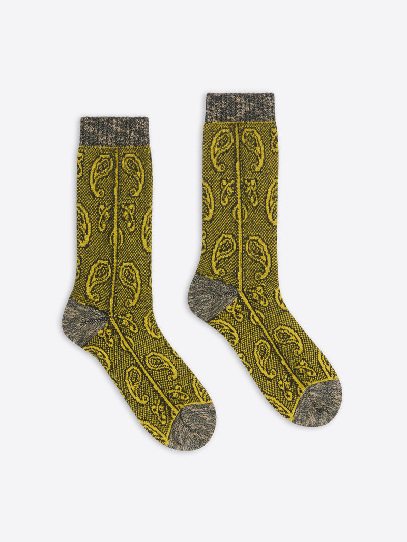 Pair of khaki socks with a pattern on a white background
