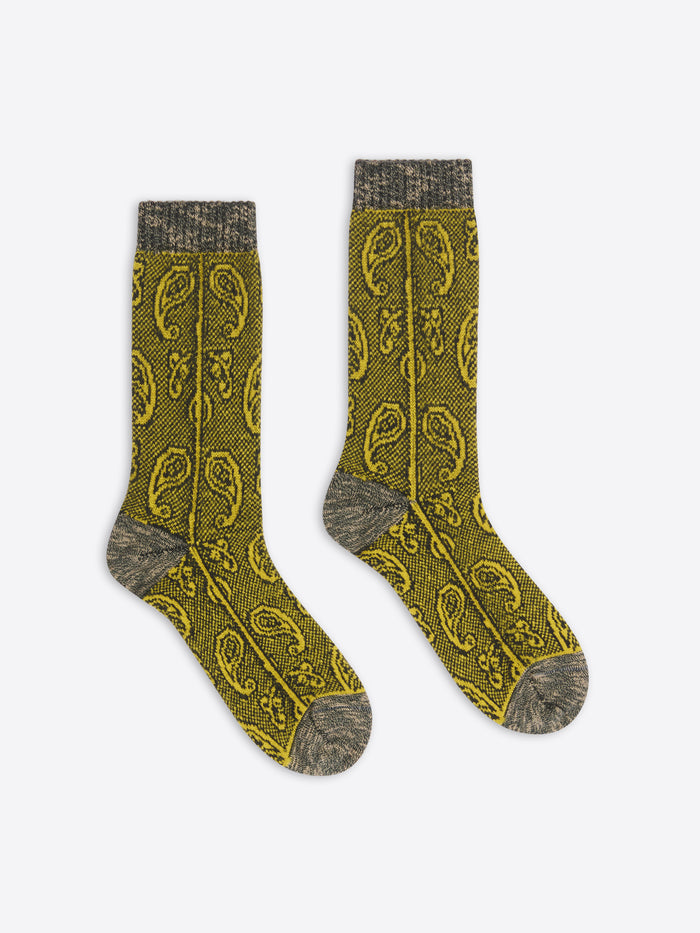 Pair of khaki socks with a pattern on a white background