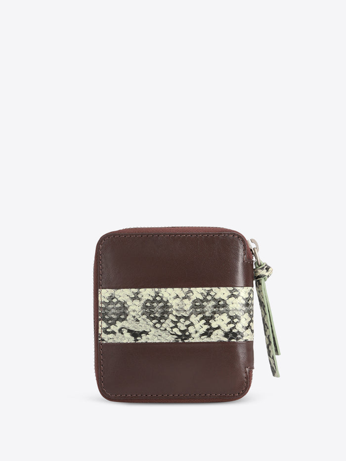 A small brown leather zip-around wallet with a horizontal black and beige snakeskin pattern stripe across the front, shown on a light gray background.