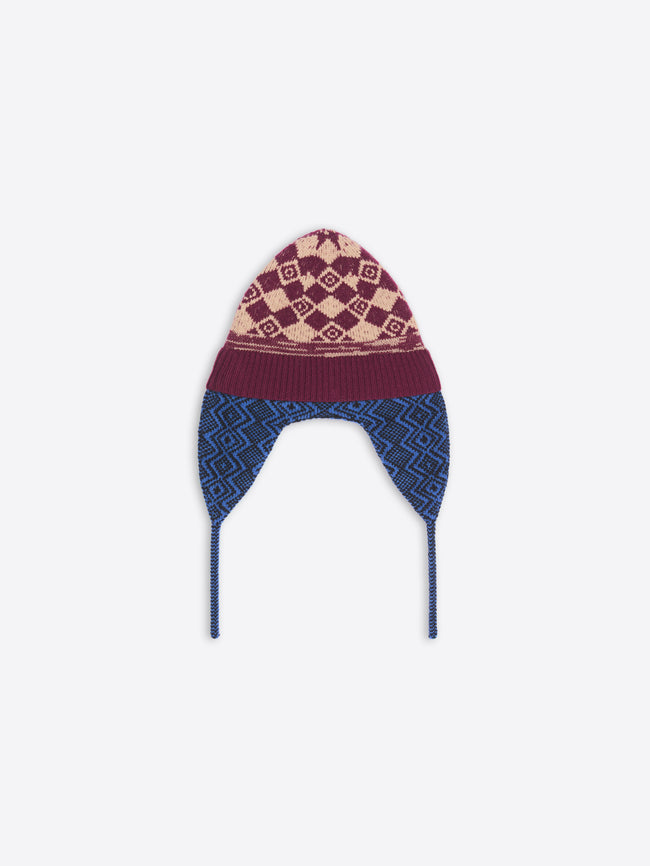 Knitted hat with patterned top and blue sides on a white background