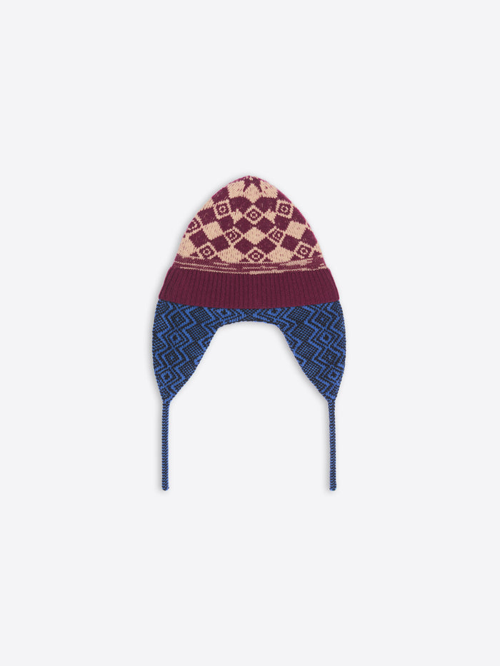 Knitted hat with patterned top and blue sides on a white background