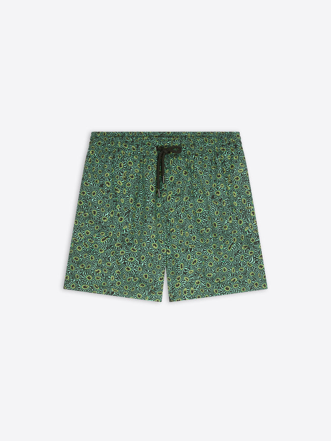 A pair of men's shorts featuring an all-over green and yellow floral pattern, with a black drawstring at the elastic waistband, shown flat on a light gray background.