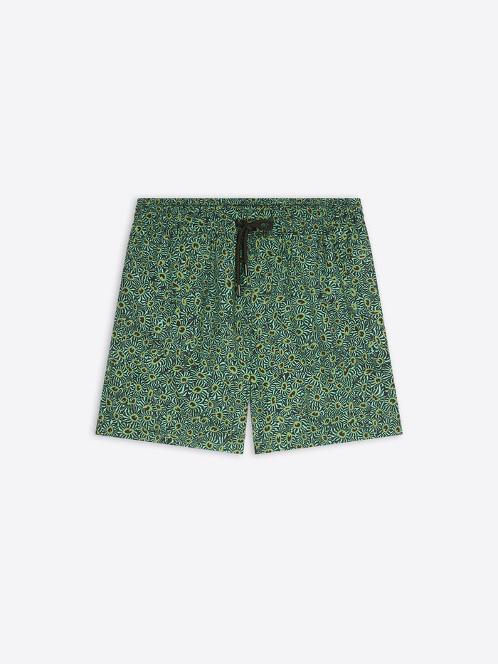 A pair of men's shorts featuring an all-over green and yellow floral pattern, with a black drawstring at the elastic waistband, shown flat on a light gray background.