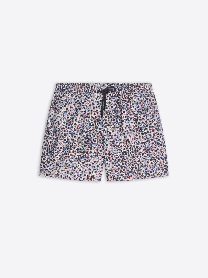 Floral patterned swim shorts on a white background