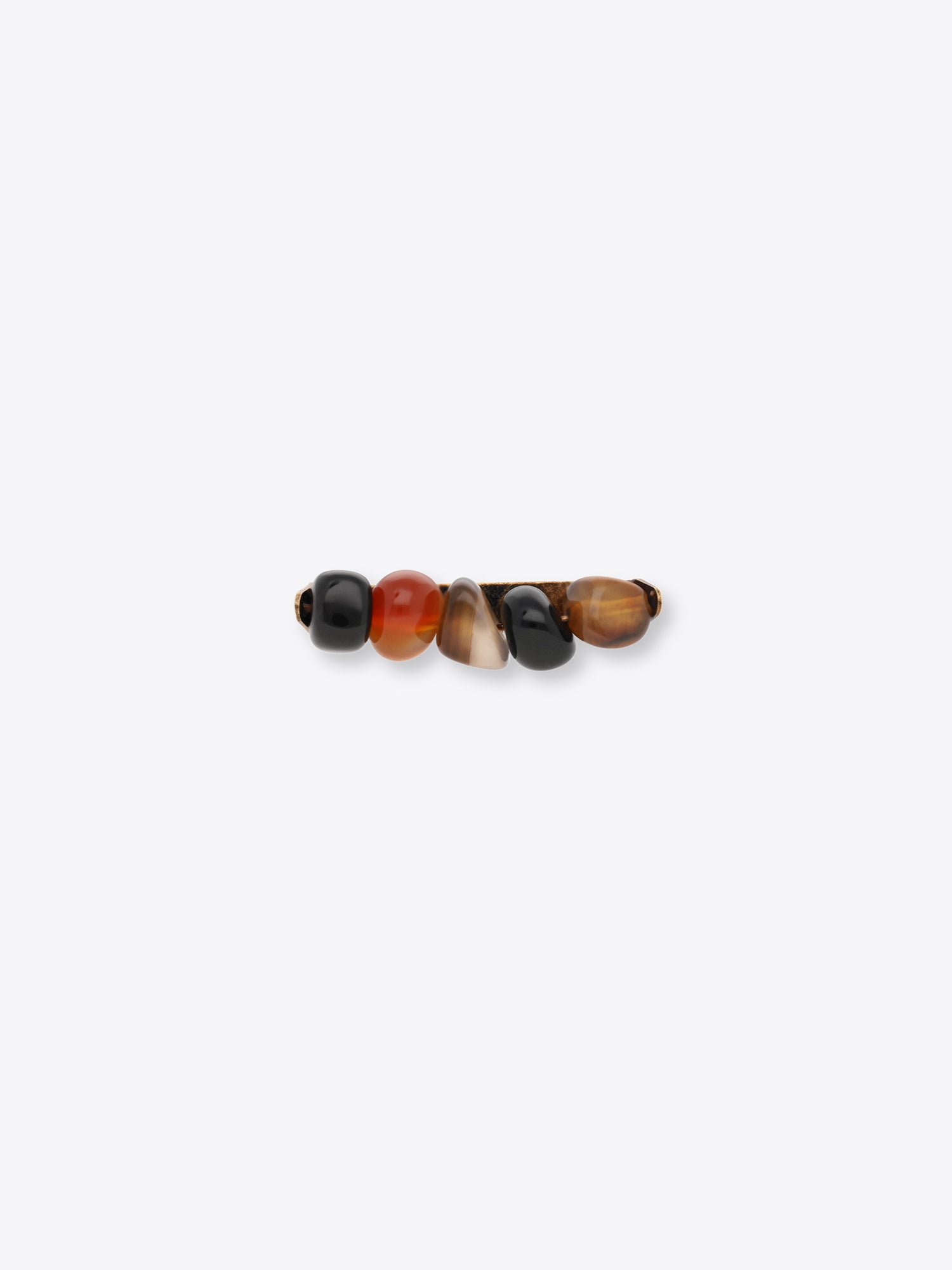 A multicolored stone tie pin with five polished beads in black, orange-brown, and brown, shown against a light gray background.