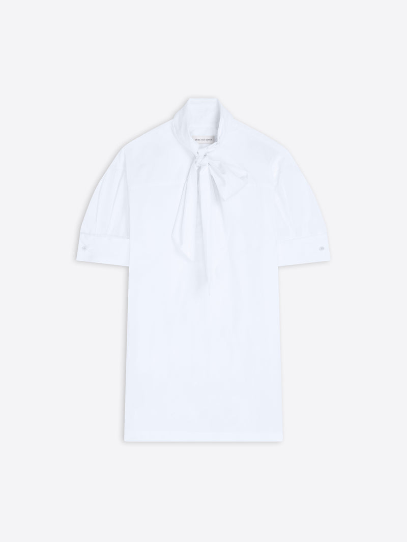White blouse with a tie neckline on a light background