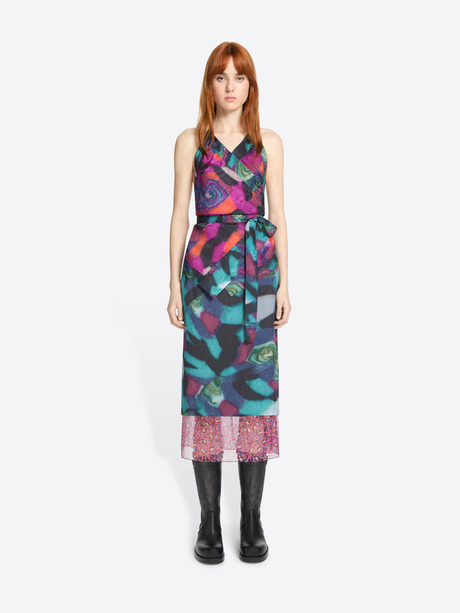 Model wearing a colorful patterned set on a white background