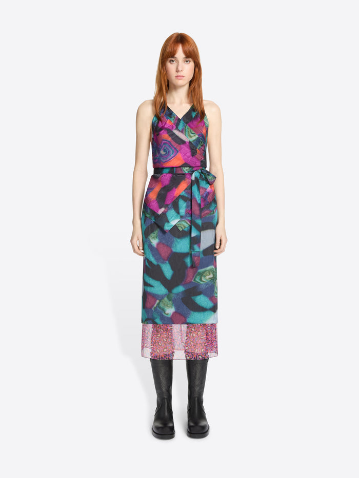 Model wearing a colorful patterned set on a white background