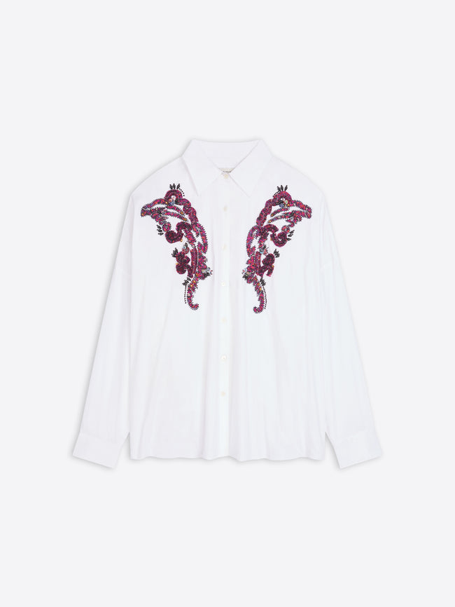 White shirt with purple floral embroidery on a white background