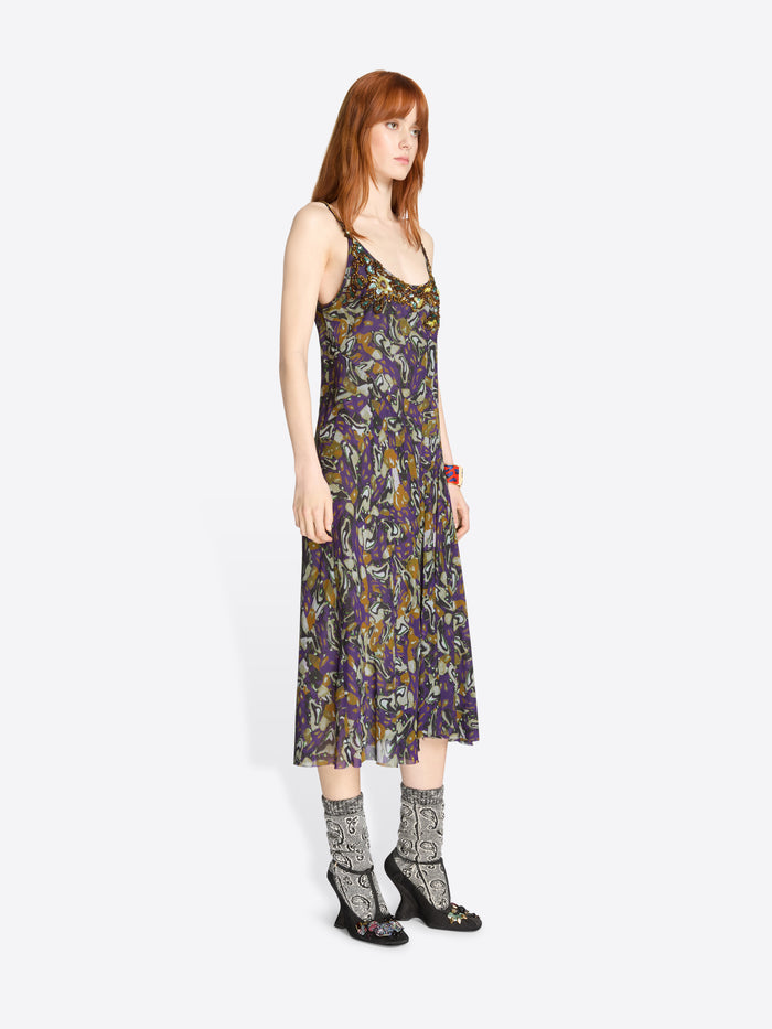 Woman wearing a floral dress on a white background