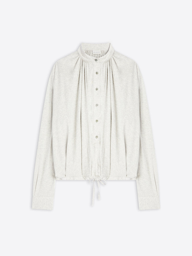 Light-toned blouse on a white background