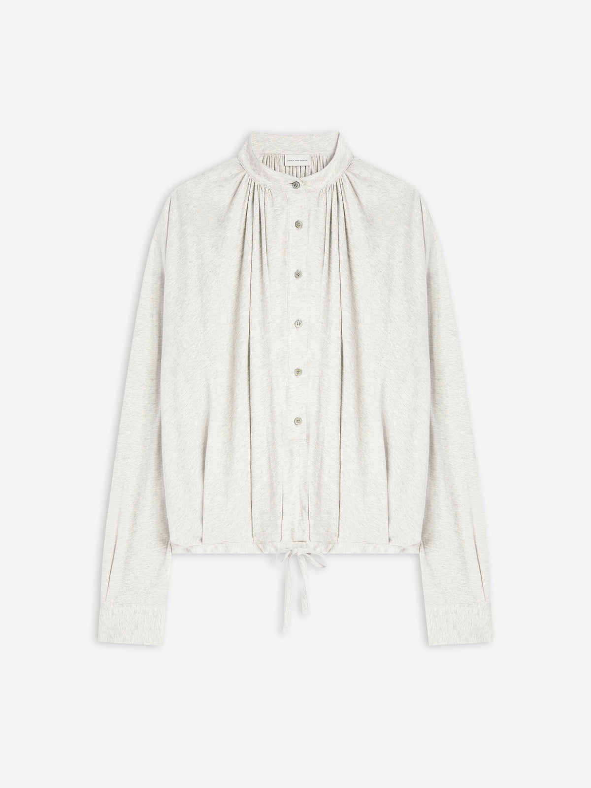 Light-toned blouse on a white background