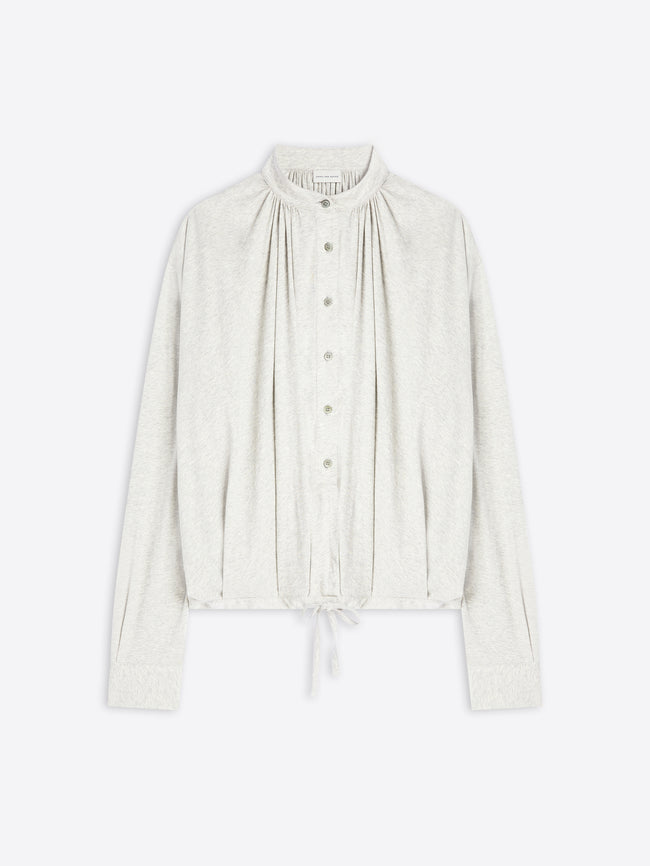 Light-toned blouse on a white background