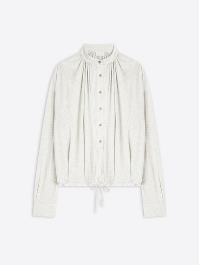 Light-toned blouse on a white background