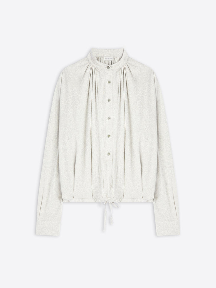 Light-toned blouse on a white background