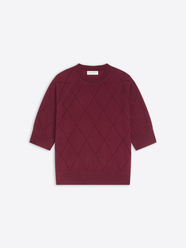 Burgundy knit top with diamond pattern on a white background