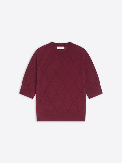 Burgundy knit top with diamond pattern on a white background