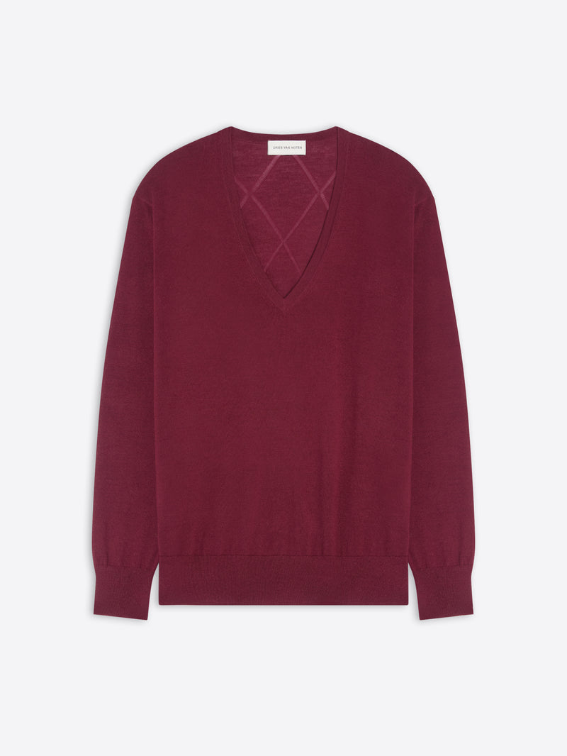 Burgundy sweater with a geometric cutout design on a white background