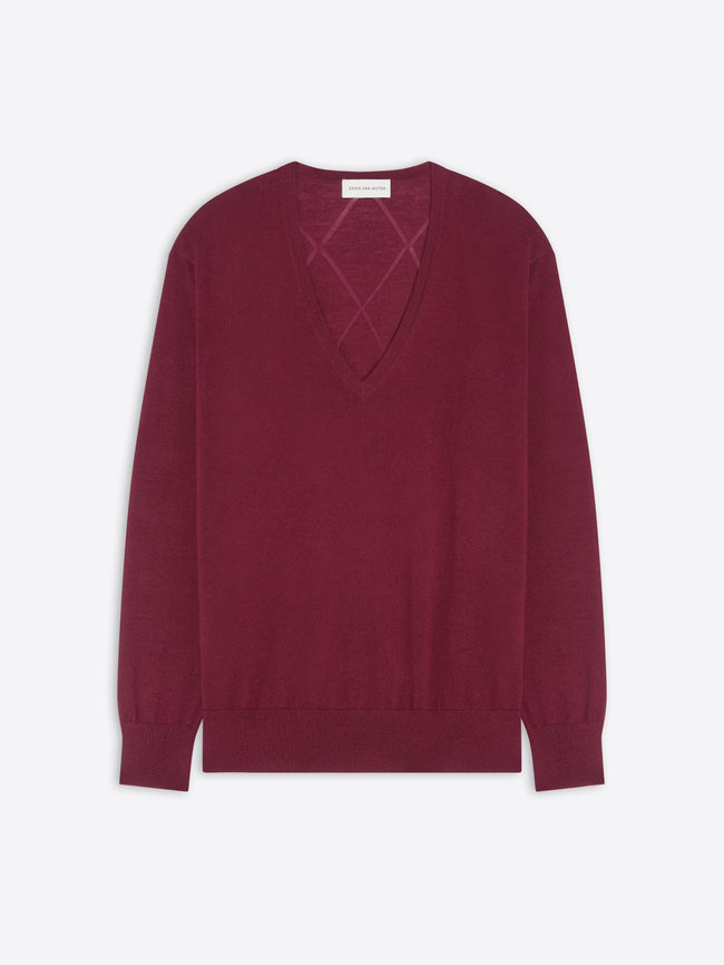 Burgundy sweater with a geometric cutout design on a white background