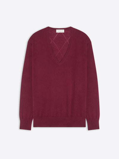 Burgundy sweater with a geometric cutout design on a white background