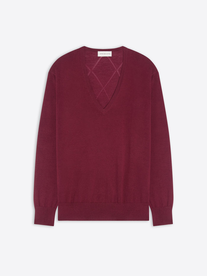 Burgundy sweater with a geometric cutout design on a white background