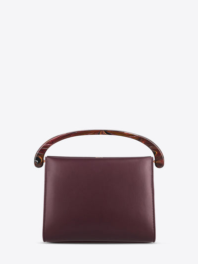 Burgundy handbag with wooden handle on a white background