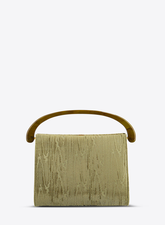 Green textured handbag with a handle on a white background