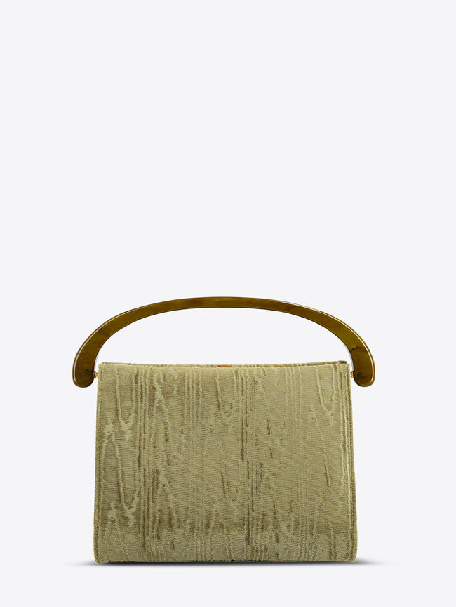 Green textured handbag with a handle on a white background