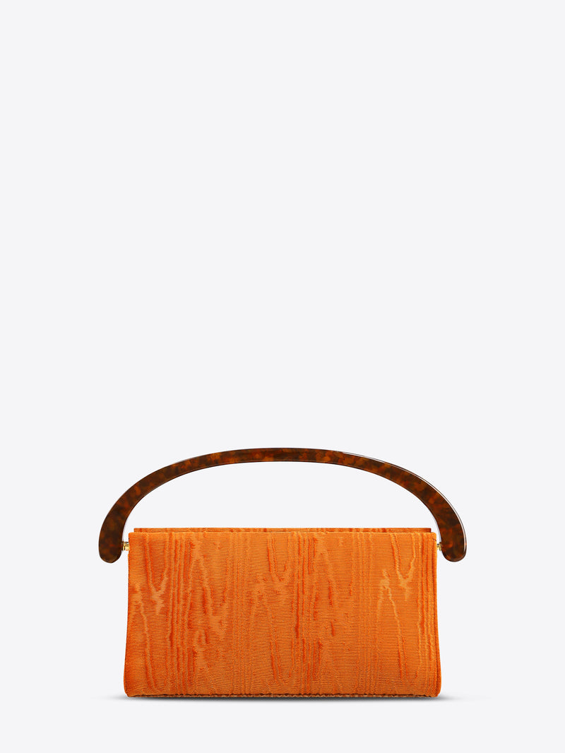 Orange clutch bag with brown handle on a white background